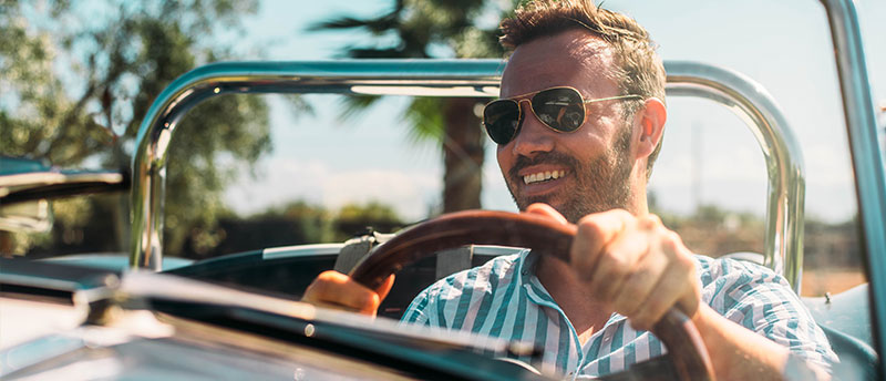 man driving convertible