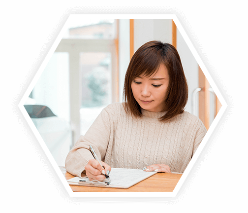 woman filling out papers at an allergist's office