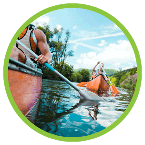 children canoeing at summer camp